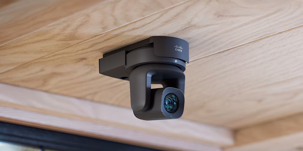 Cisco collaboration devices arranged in a modern meeting room.